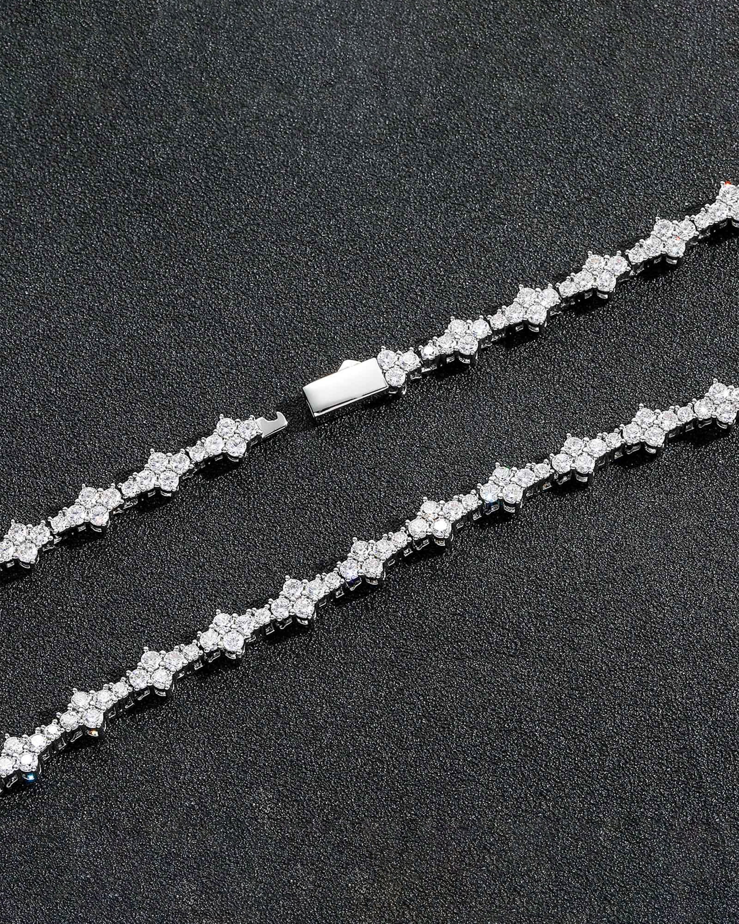 Close-up of the Celeste Furry & Me Necklace pendant, featuring shimmering star-like gemstones and fine golden details.