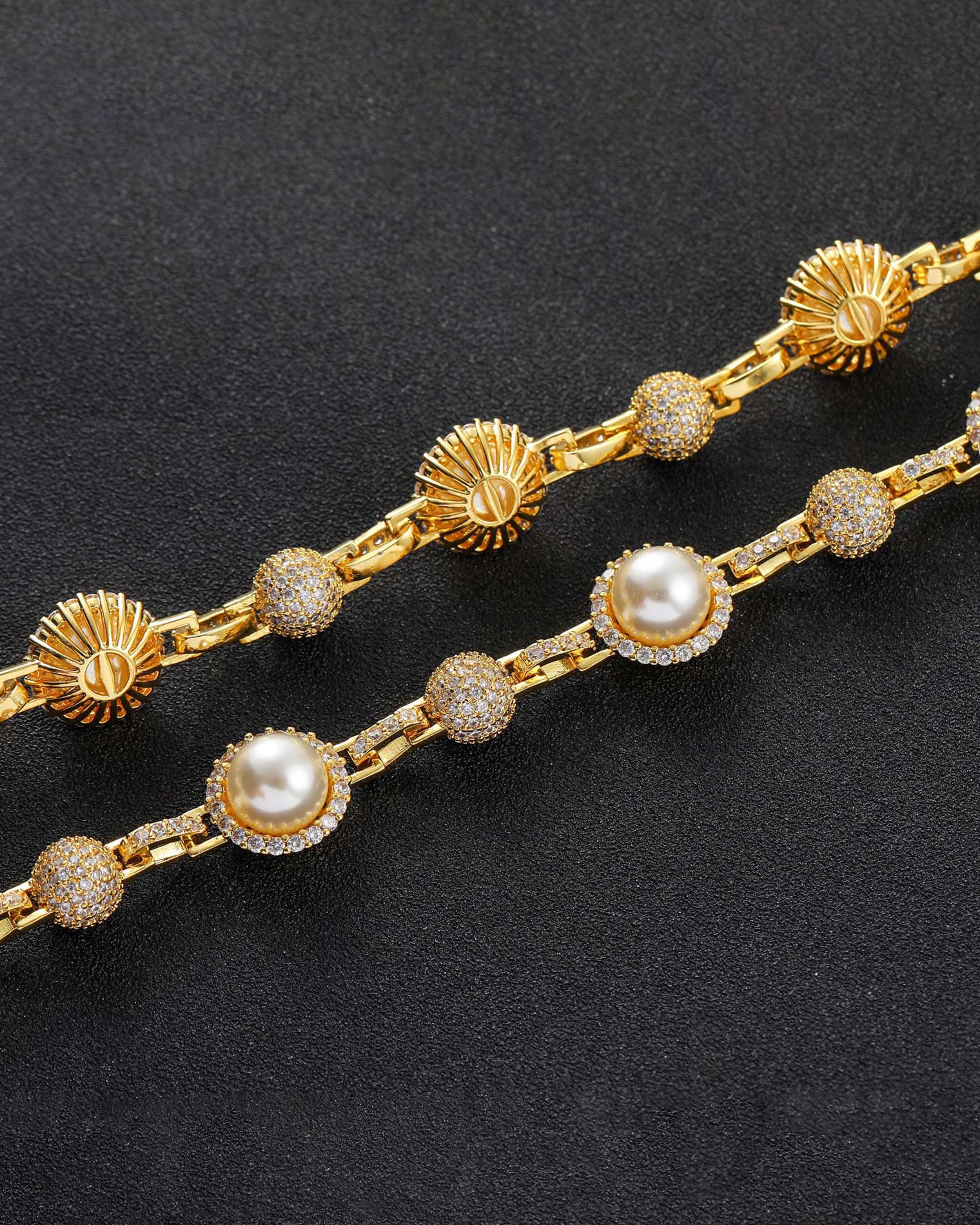 Close-up of Pearl Paw & Me Jewelry Set showing lustrous pearls and gold accents that reflect warmth and elegance.